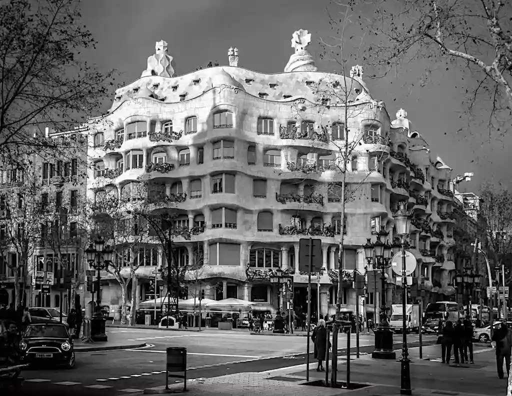 Modernist Casa Milà building on a street corner in Barcelona