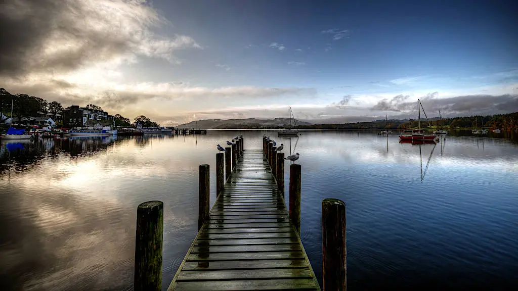 Pier at sunset at Windermere lake in the Lake District