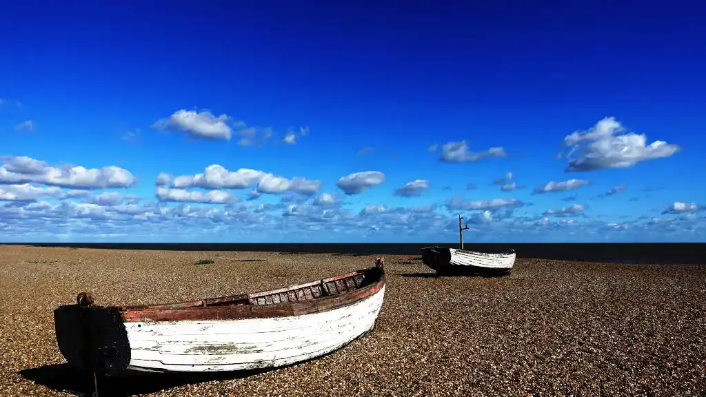 Shingle beach with fishing boat at Aldeburgh beach, Suffolk